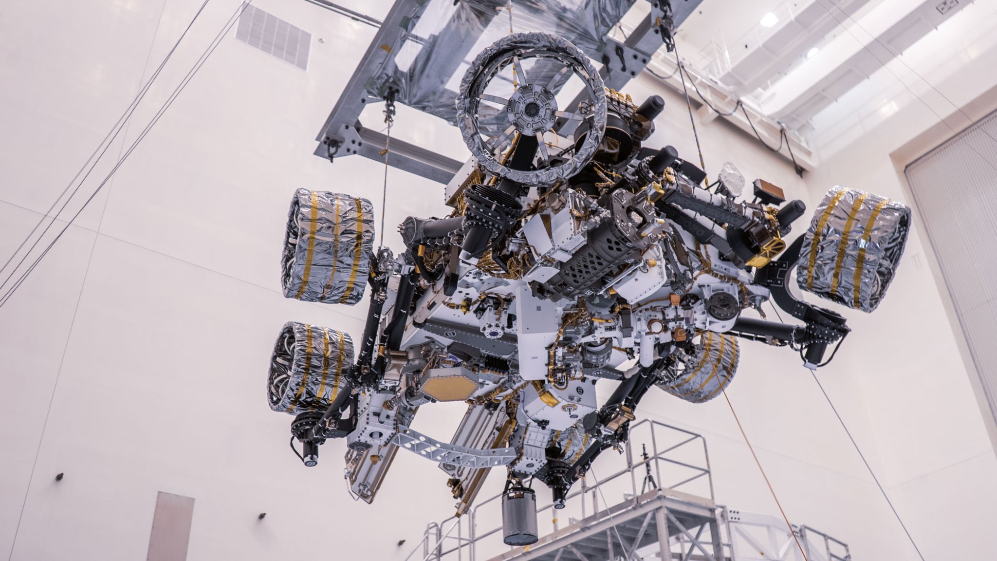 NASA's Perseverance rover is moved during a test of its mass properties at Kennedy Space Center in Florida. 