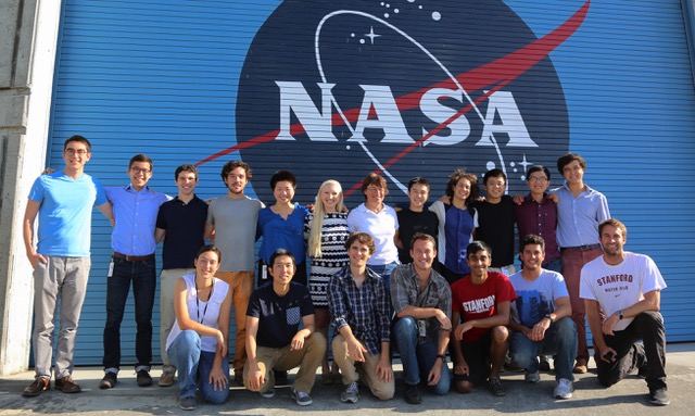group photo in front of NASA logo
