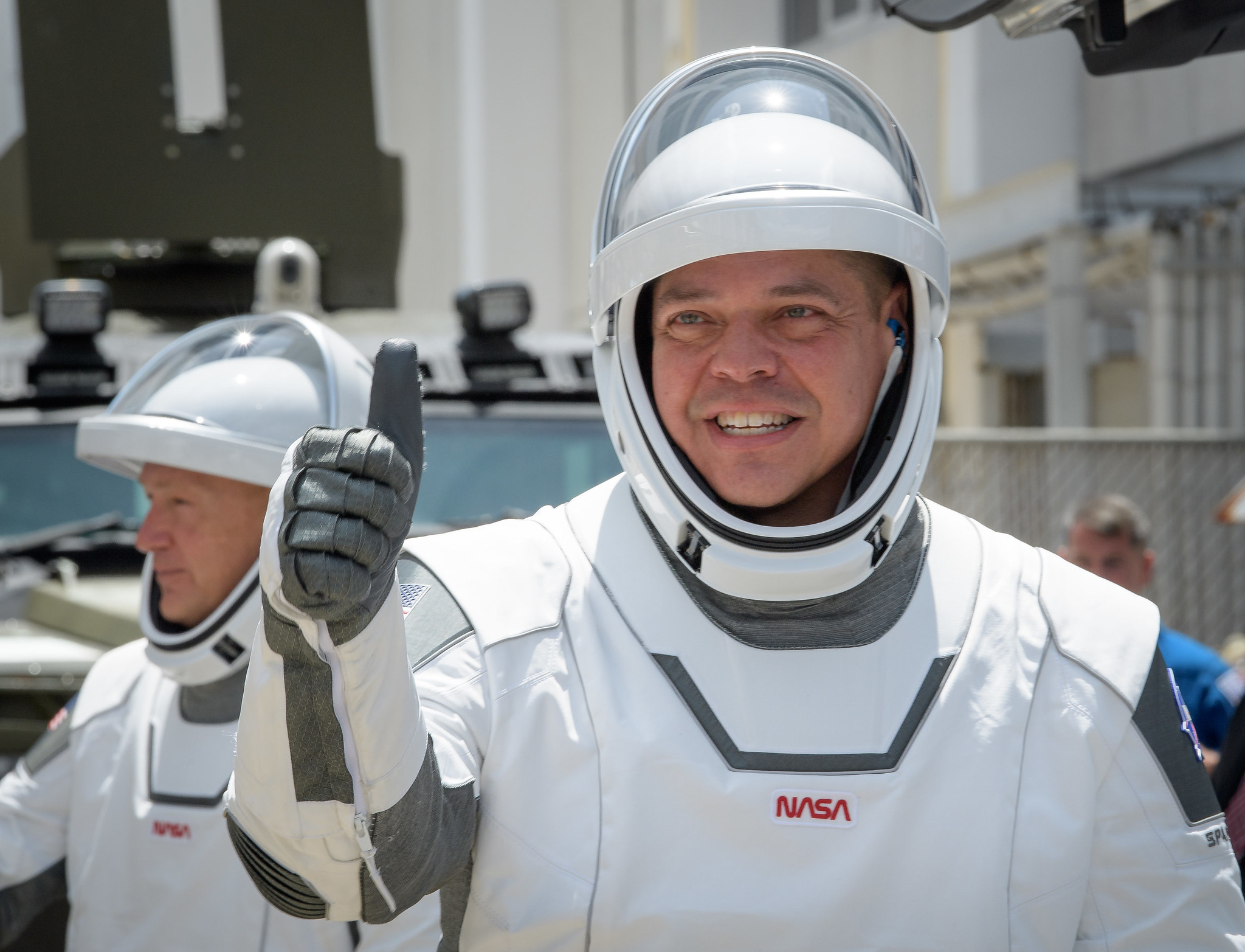 NASA astronauts Robert Behnken, foreground, and Douglas Hurley, wearing SpaceX spacesuits