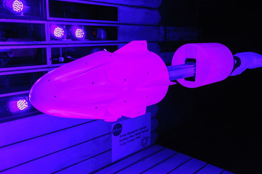 A model of SpaceX’s Crew Dragon capsule is mounted in a wind tunnel