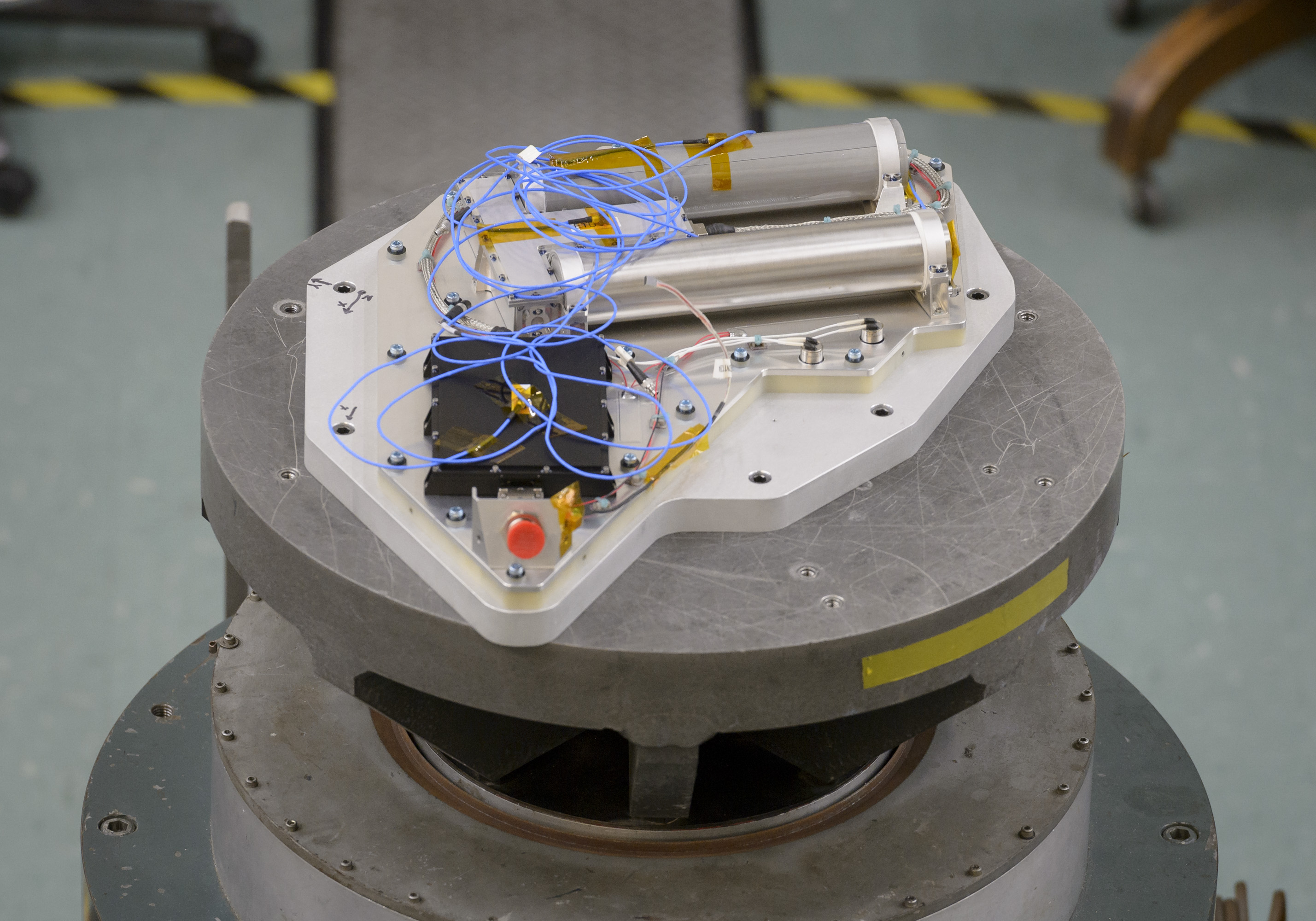 The Neutron Spectrometer System hardware on a vibration table.