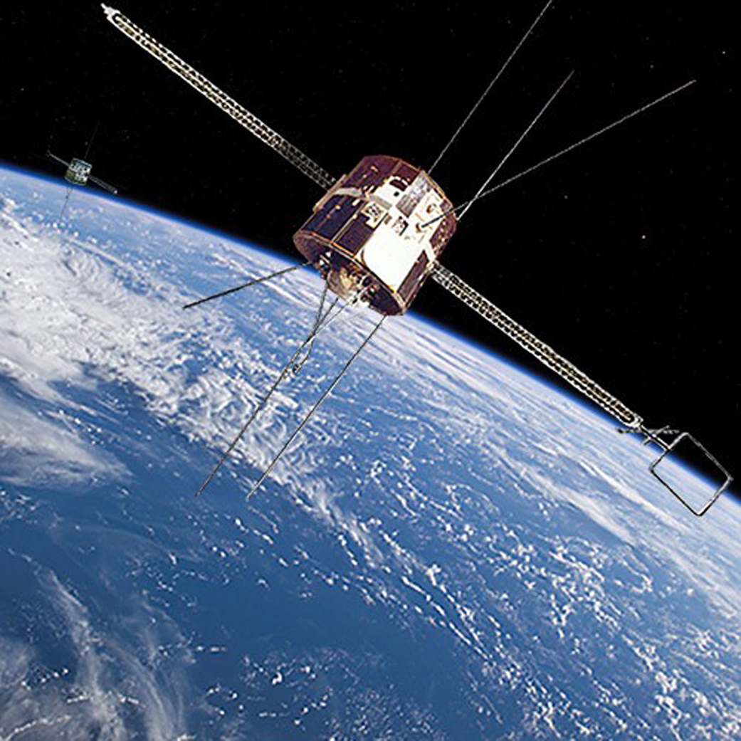 Image from early 1980s of NASA's dual-spacecraft Dynamics Explorer mission spacecraft orbiting Earth.