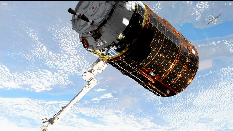 Japan's HTV-9 resupply ship is pictured in the grips of the Canadarm2 robotic arm