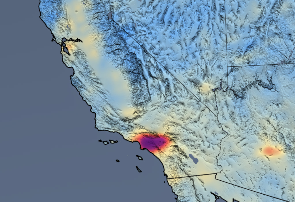 Data visualization of nitrogen dioxide concentrations over the southwest US. Most of the map is light blue fading to yellow, representing lower concentrations, with a mass of darker red to purple over LA, representing higher concentrations. The mass is smaller and lighter than in the previous image.