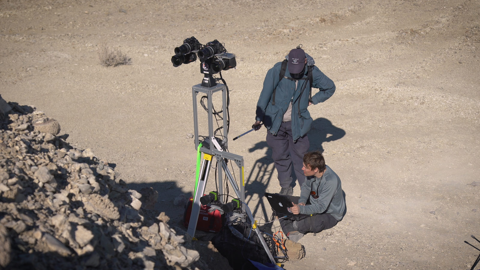 Two members of the field team set up cameras 