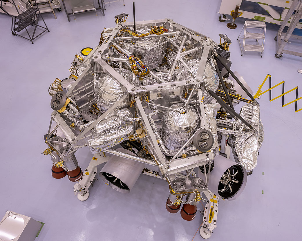 Rocket-powered descent stage sitting on to of NASA's Perseverance rover