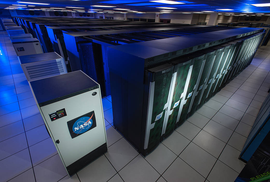 Photo of rows of computer racks that make up the Pleiades supercomputer