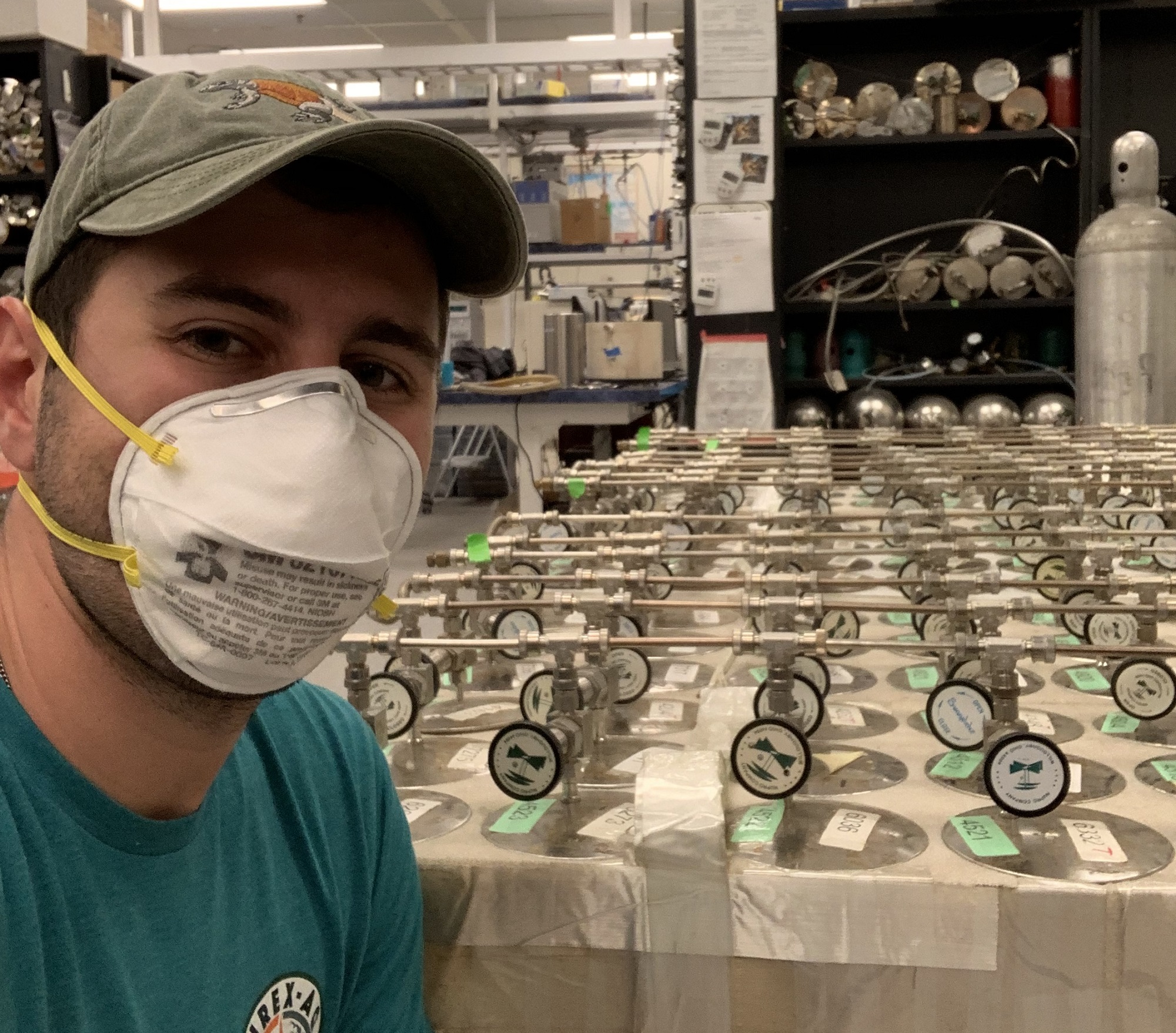 Alex Jarnot prepares air sampling canisters for shipment to all NASA SARP interns.