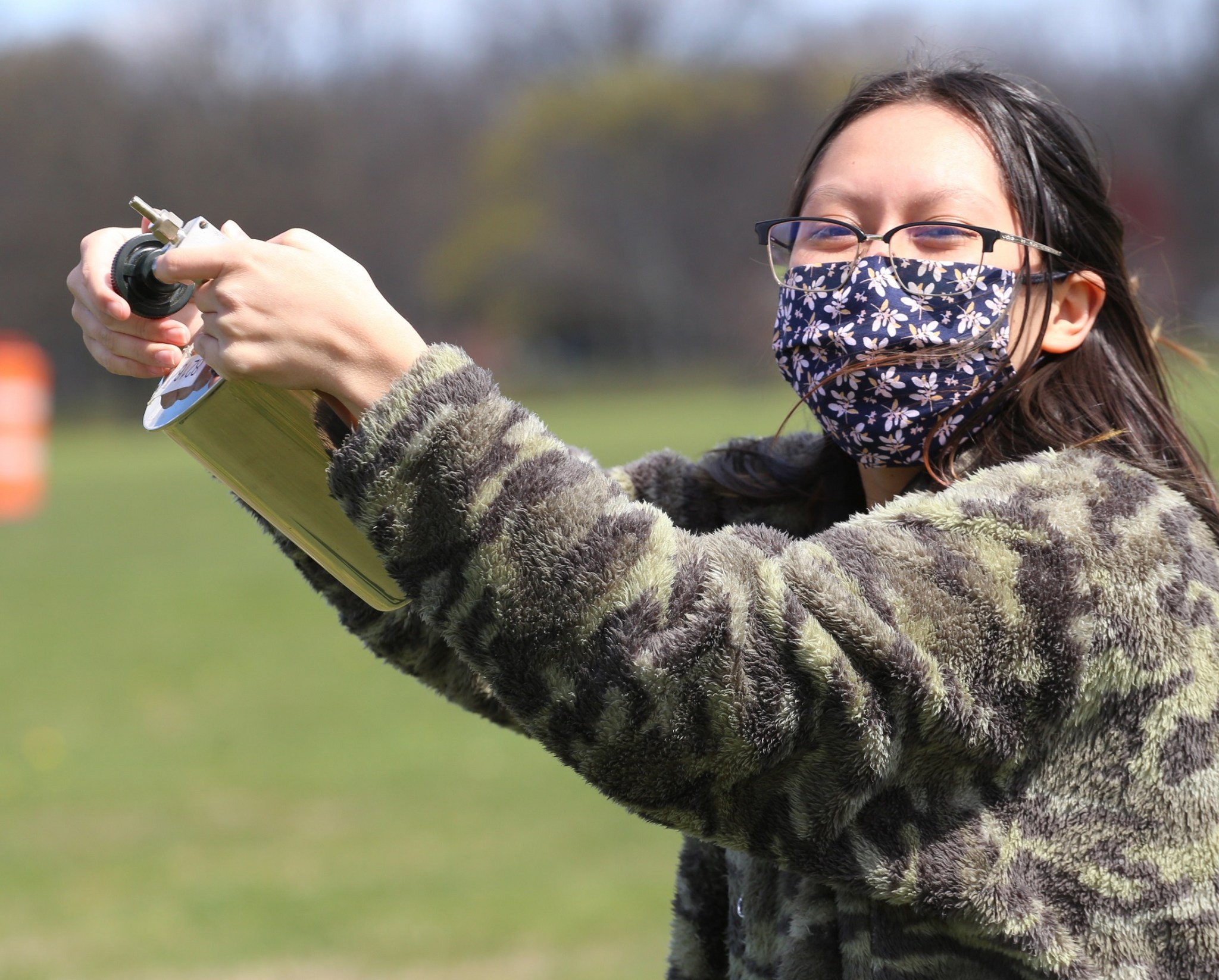 SARP intern Gabriela Vidad, a physics major from Adelphi University in New York, takes an air sample near her home.