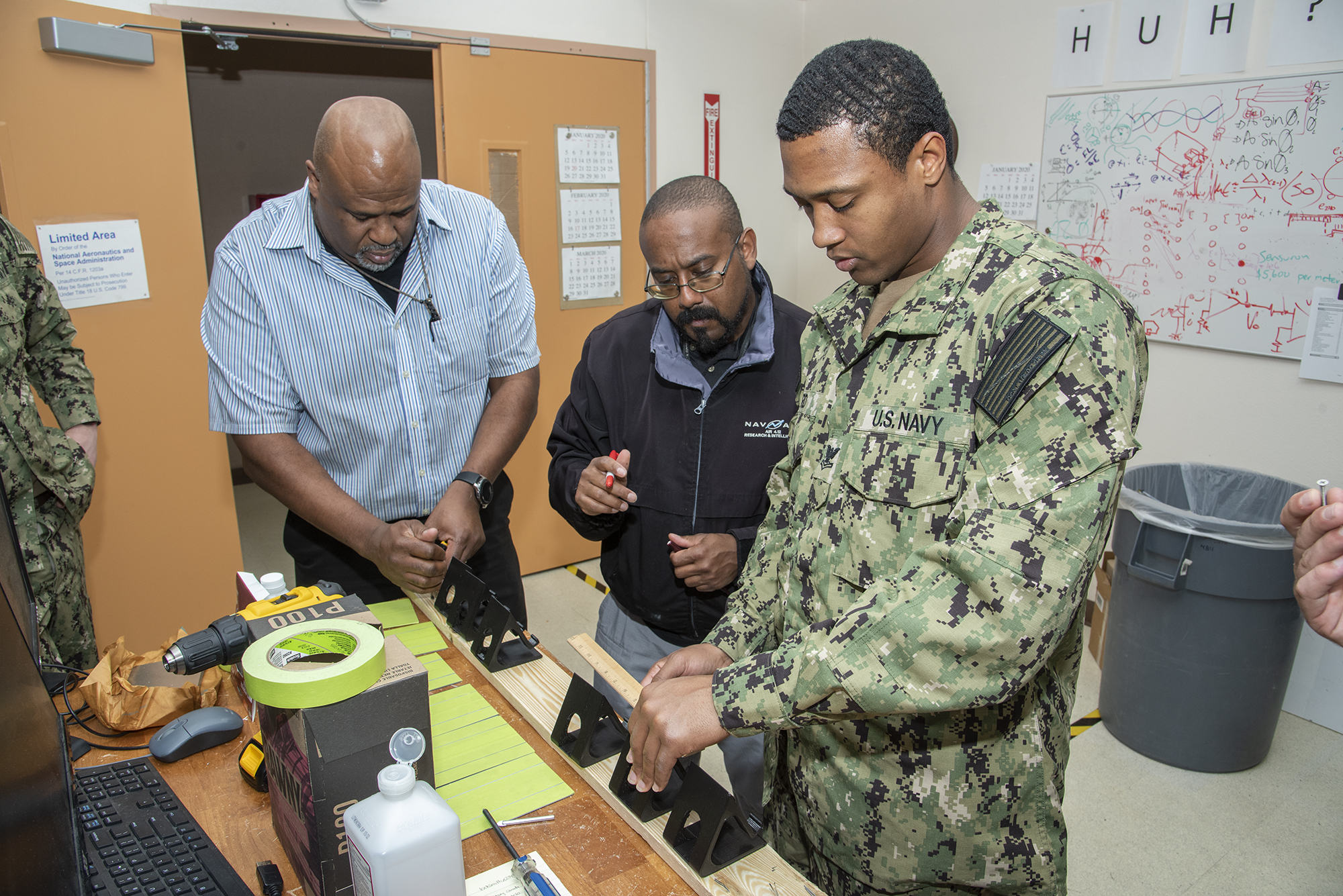 Alan Parker works with U. S. Navy staff on microFOSS project.