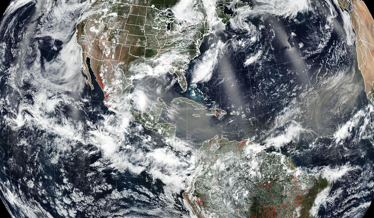 A "true color" image of the U.S. and northern South America from a satellite view, clouds are covering a lot of the image. 