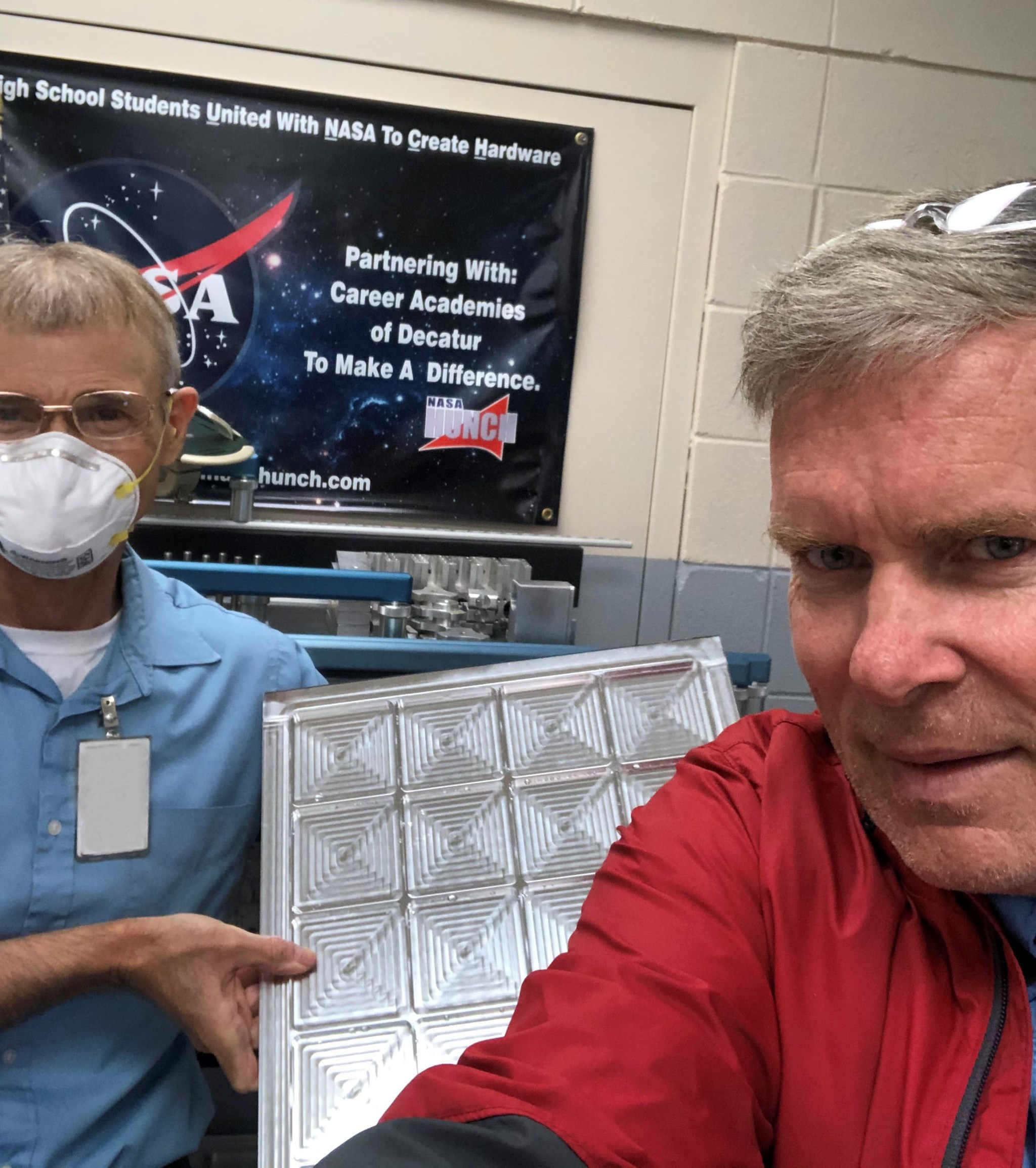 Marshall’s Bill Gibson, left, and Bob Zeek with the HUNCH lockers that they completed for the Demo-2 flight.