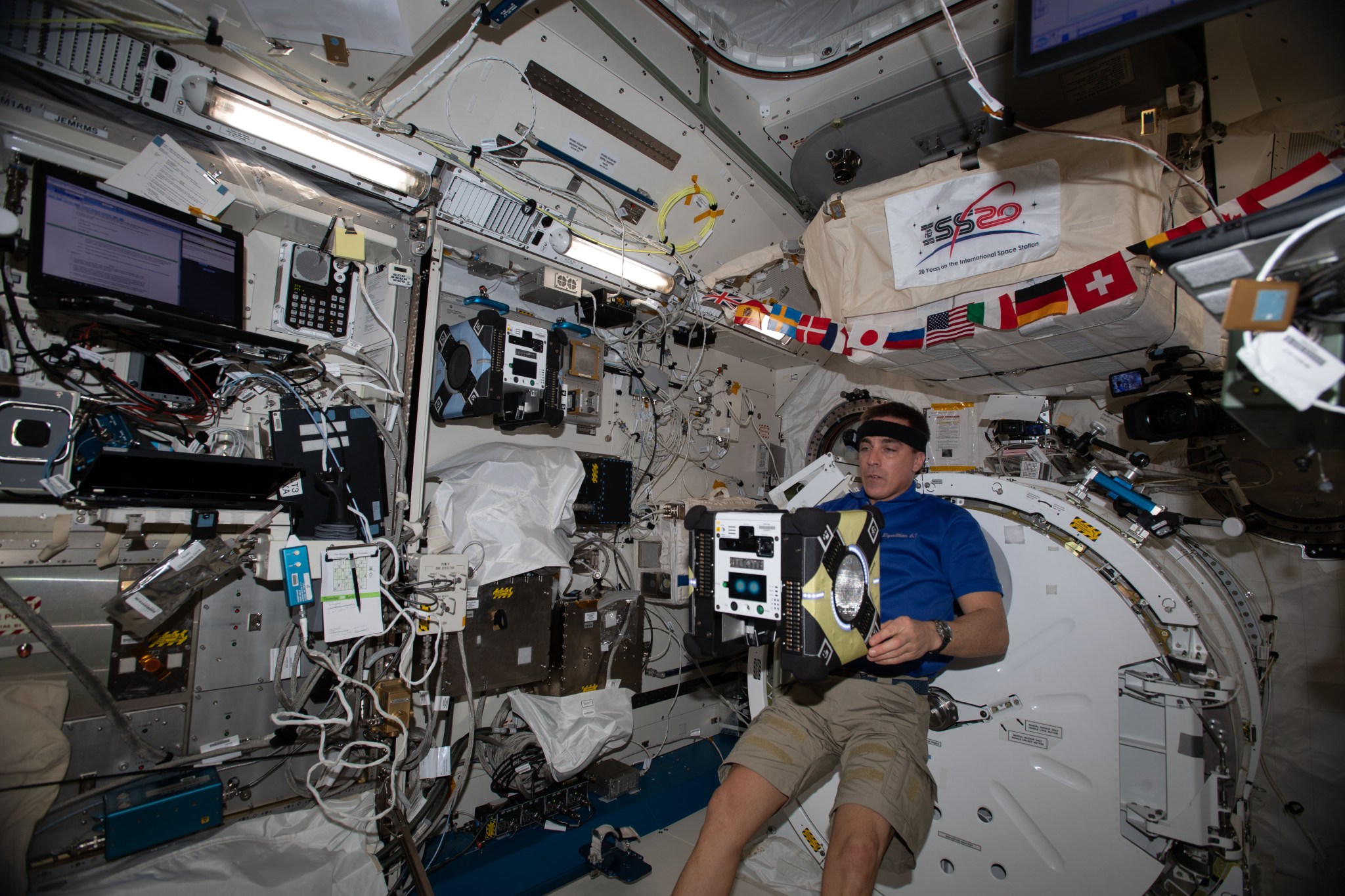 astronaut Chris Cassidy works with Honey robot
