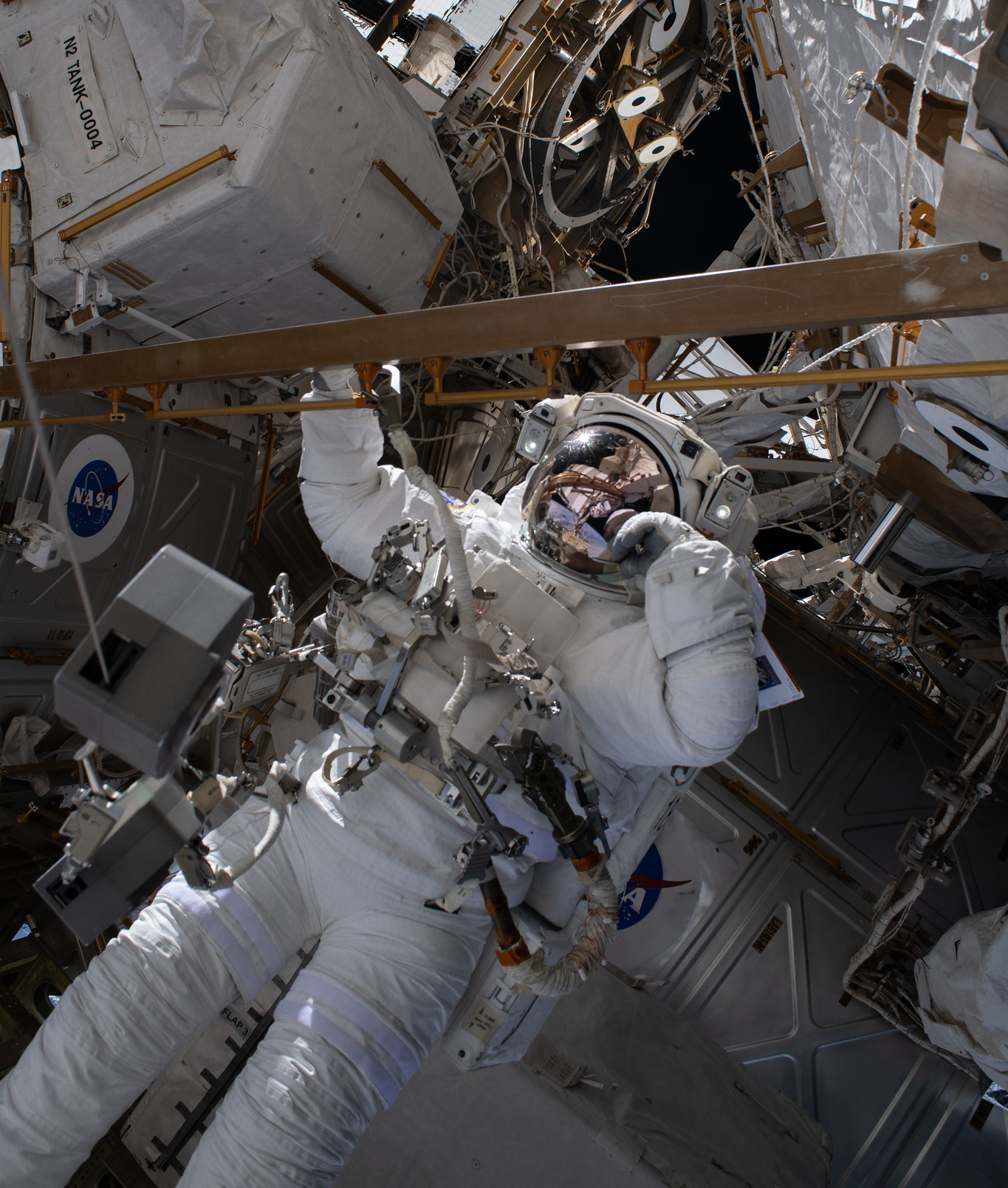 Astronaut Bob Behnken works during the July 1 spacewalk to swap an aging nickel-hydrogen battery for a new lithium-ion battery.