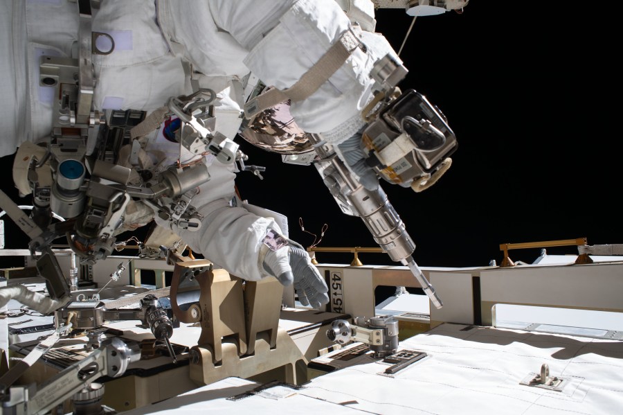 NASA astronaut and Expedition 63 Flight Engineer Bob Behnken works during a spacewalk to swap an aging nickel-hydrogen battery for a new lithium-ion battery on the International Space Station's Starboard-6 truss structure.
