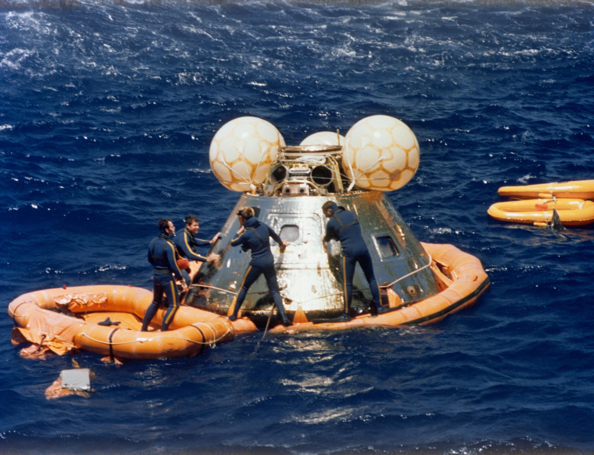 Recovery of the Apollo command module after touchdown in the Pacific Ocean near Hawaii on July 24, 1975.
