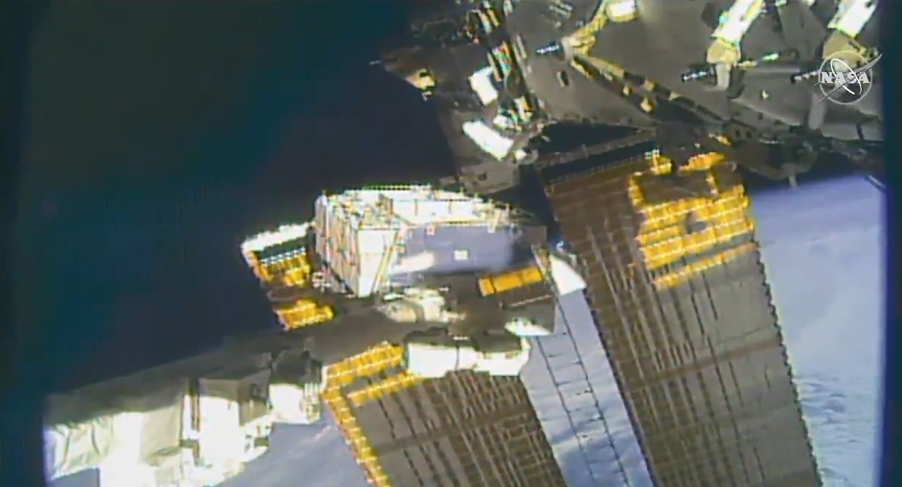 NASA astronaut pictured tethered on the space station’s truss structure during a spacewalk to swap batteries and route cables.