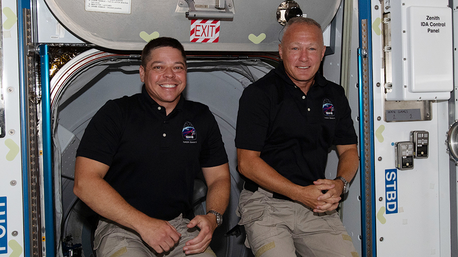 NASA astronauts (from left) Bob Behnken and Doug Hurley, are pictured inside the orbiting lab shortly after arriving aboard the SpaceX Crew Dragon spacecraft on May 31.