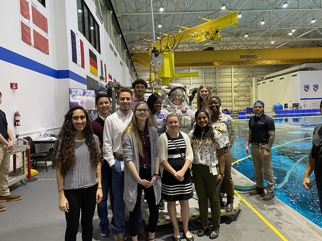 Astornaut Johnny Kim poses with interns