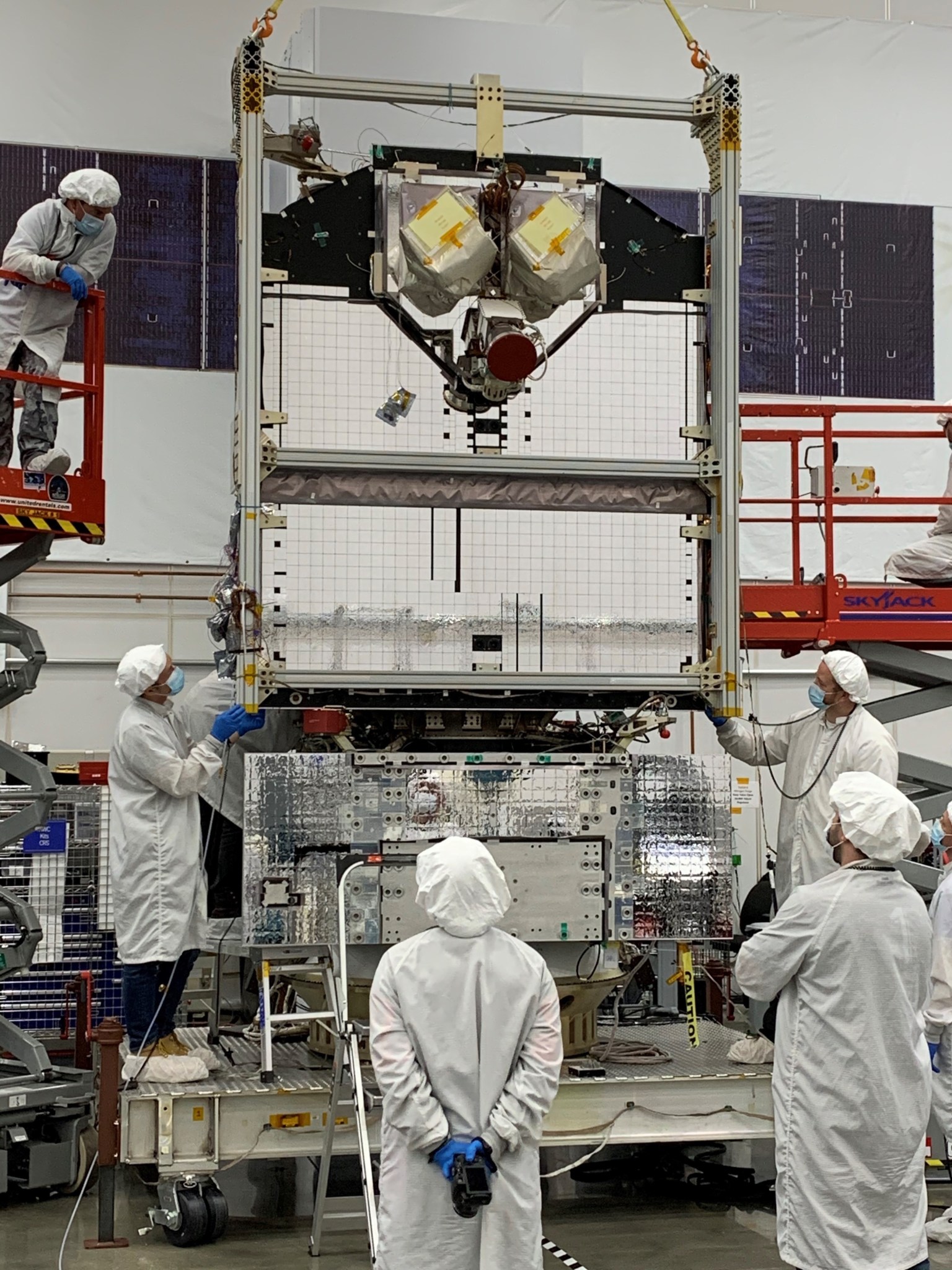 Northrop Grumman technicians in front of the fully installed and integrated Space Test Program Satellite (STPSat-6). 