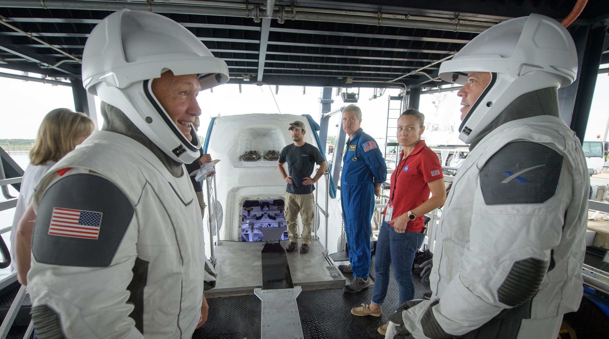 NASA astronauts Doug Hurley, left, and Bob Behnken rehearse crew extraction from SpaceX’s Crew Dragon