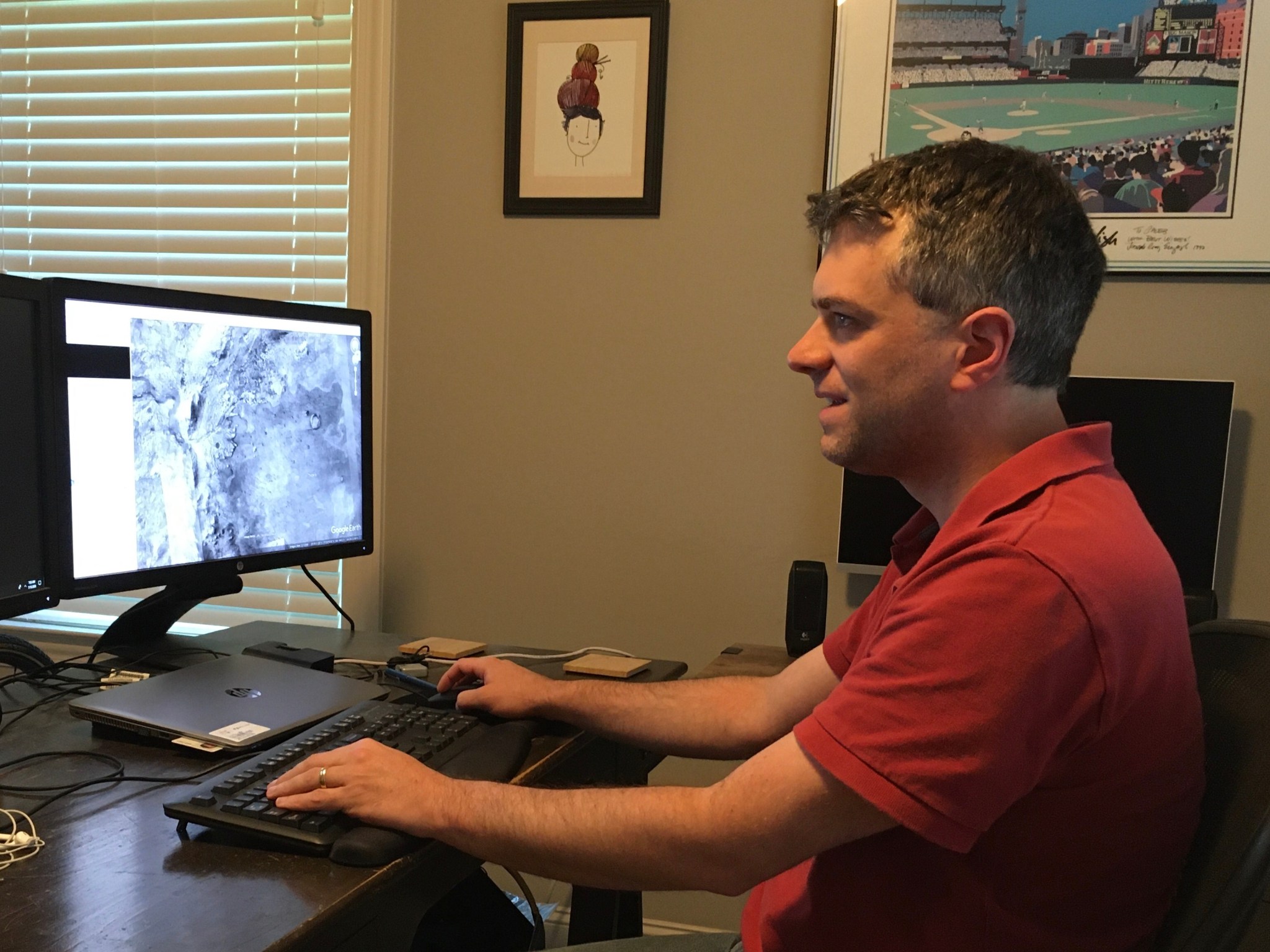 Teleworking from his home office, NASA planetary scientist Caleb Fassett studies optical images of the Jezero crater on Mars. 