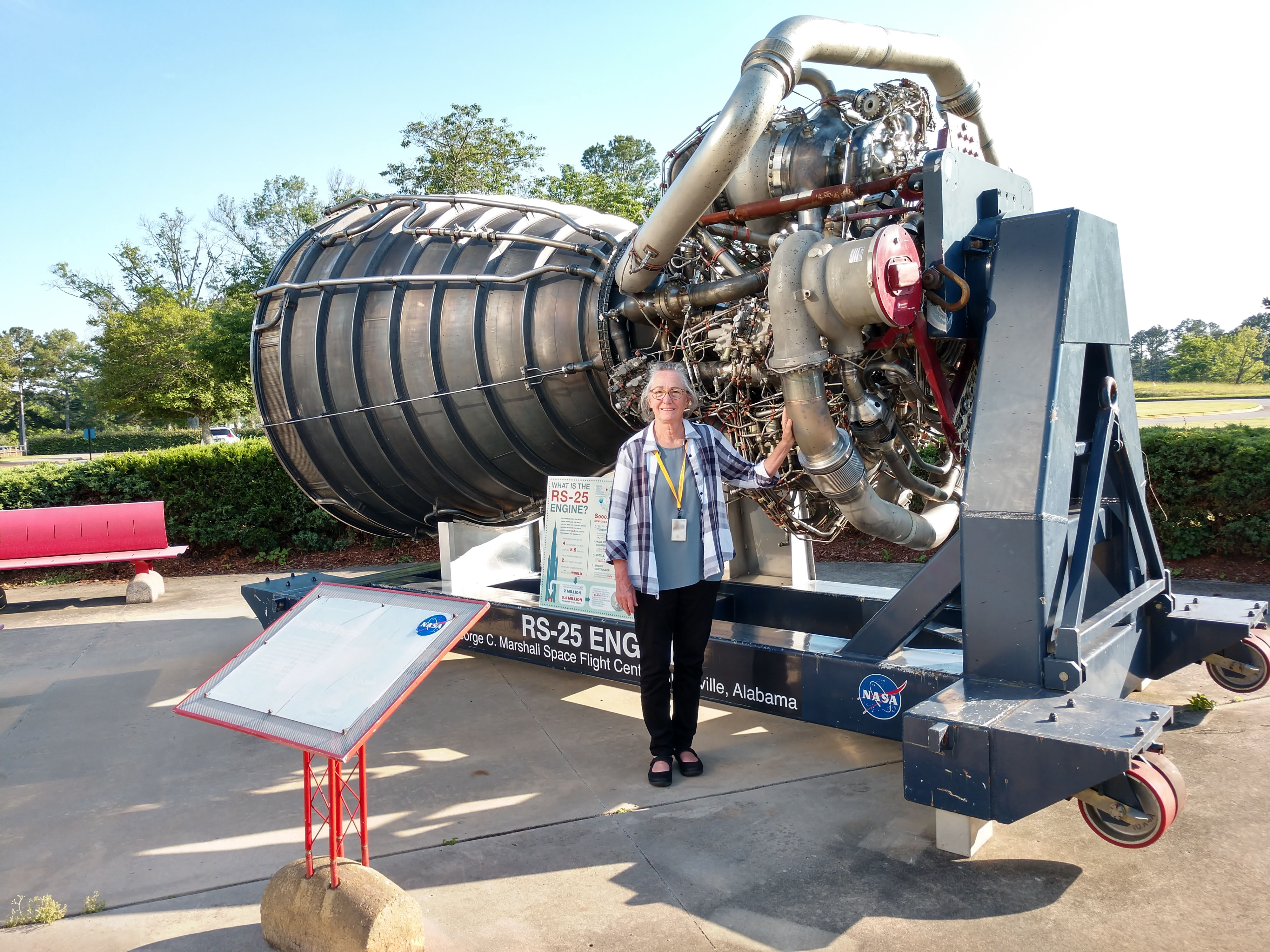 NASA Planetary Protection Officer Lisa Pratt with the R25 engine at Marshall Space Flight Center. 