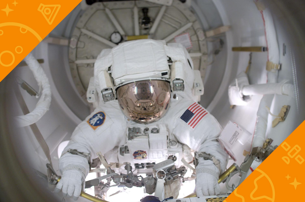 Astronaut John B. Herrington prepares to egress the airlock to begin a spacewalk