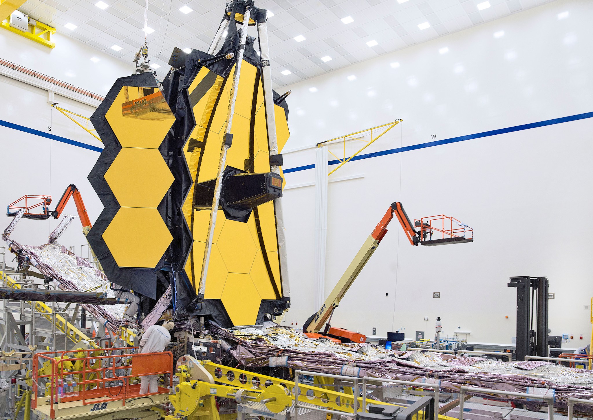 JWST shown with its primary mirror partially deployed