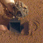The movement of sand grains in the scoop on the end of NASA InSight's robotic arm
