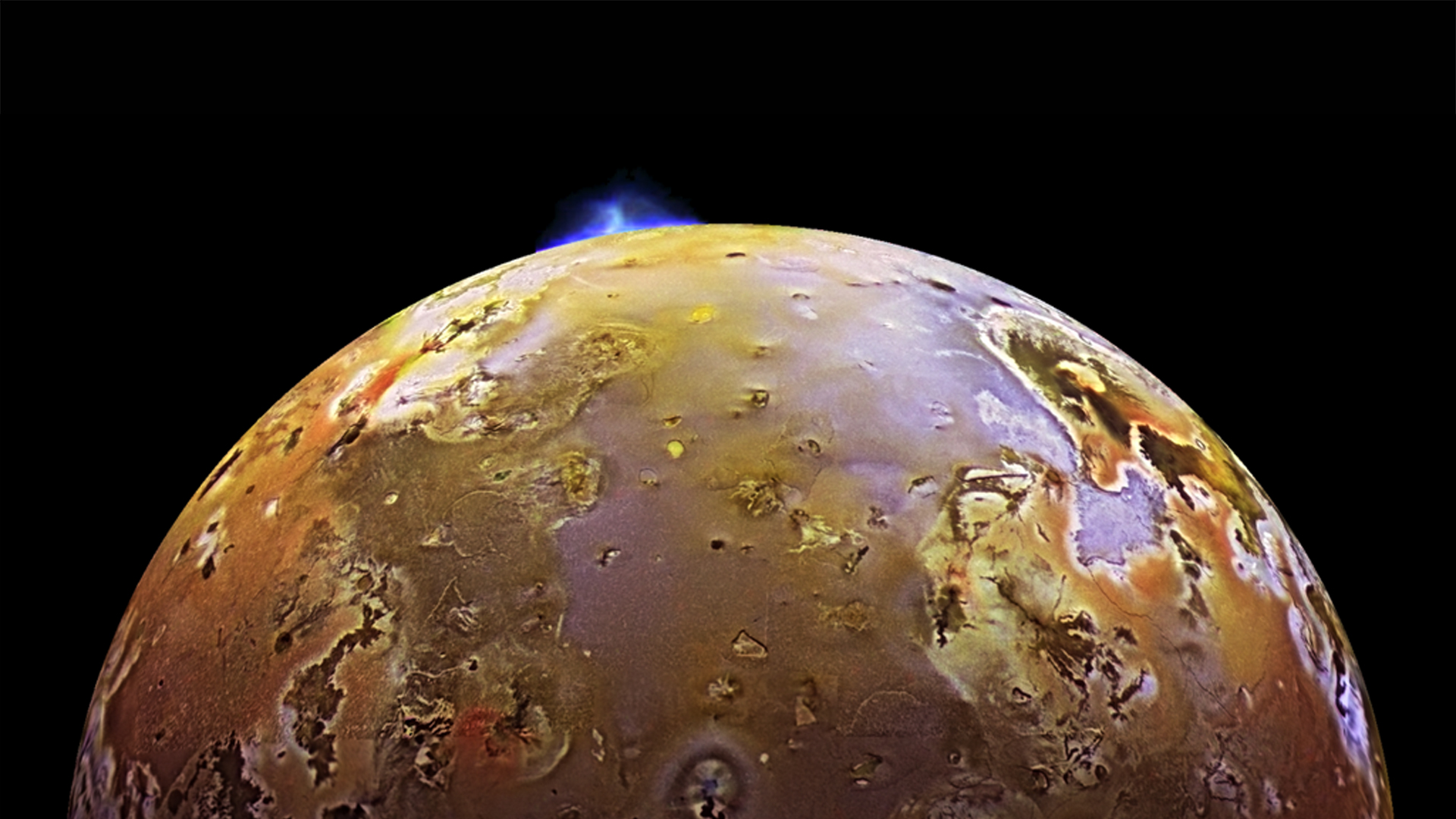 NASA's Galileo spacecraft catches Io in the midst of a volcanic eruption.