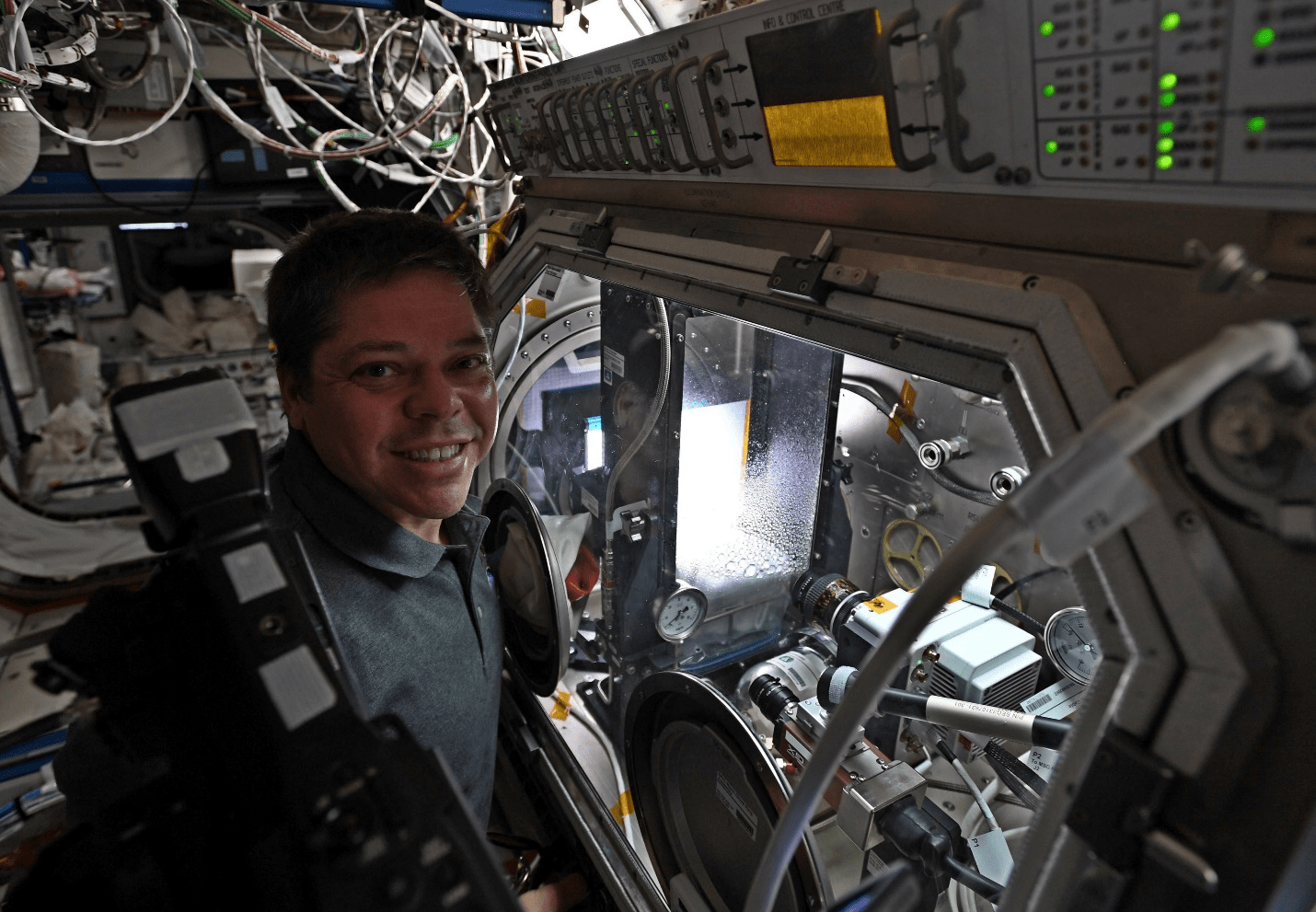 astronaut Robert Behnken running a session of the Droplet Formation experiment