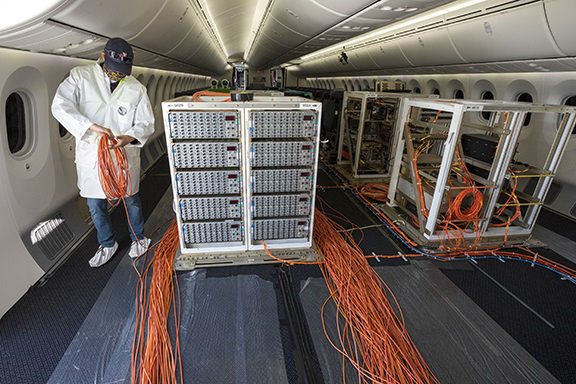 A technician works inside a Boeing 787-10 Dreamliner.