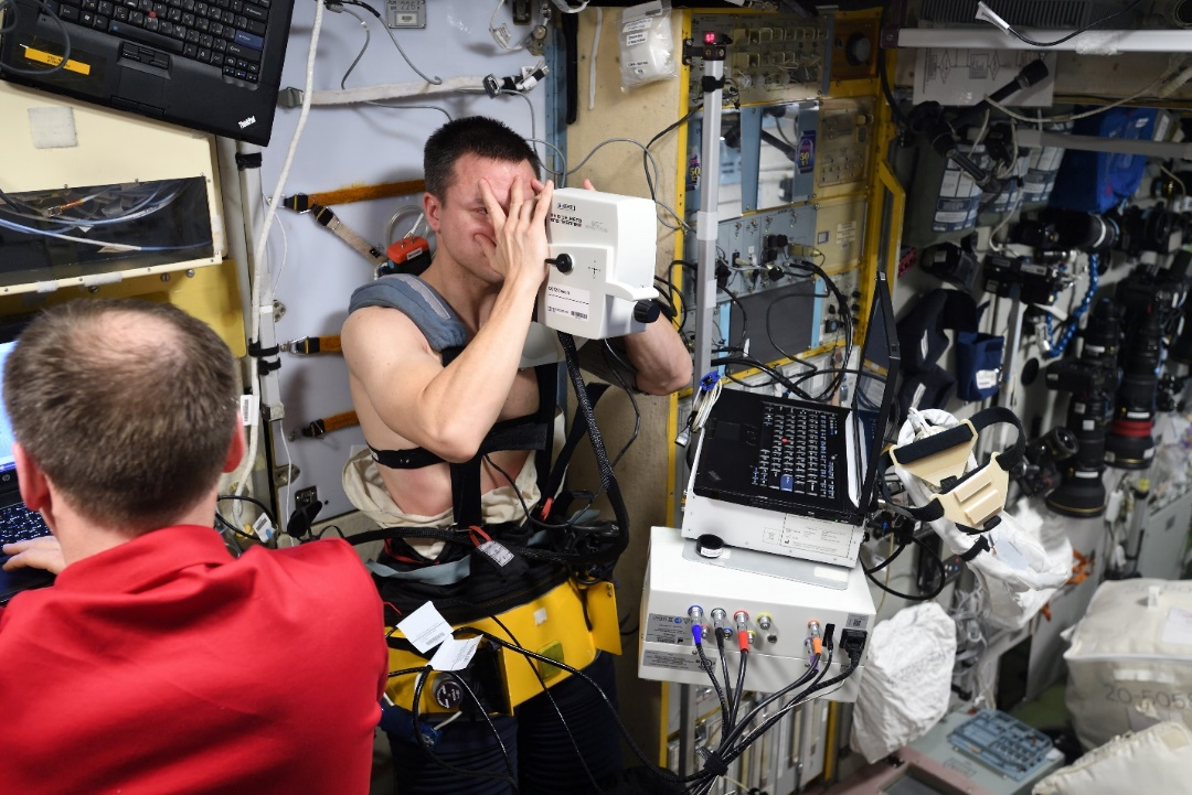 astronaut Andrew Morgan using OCT camera