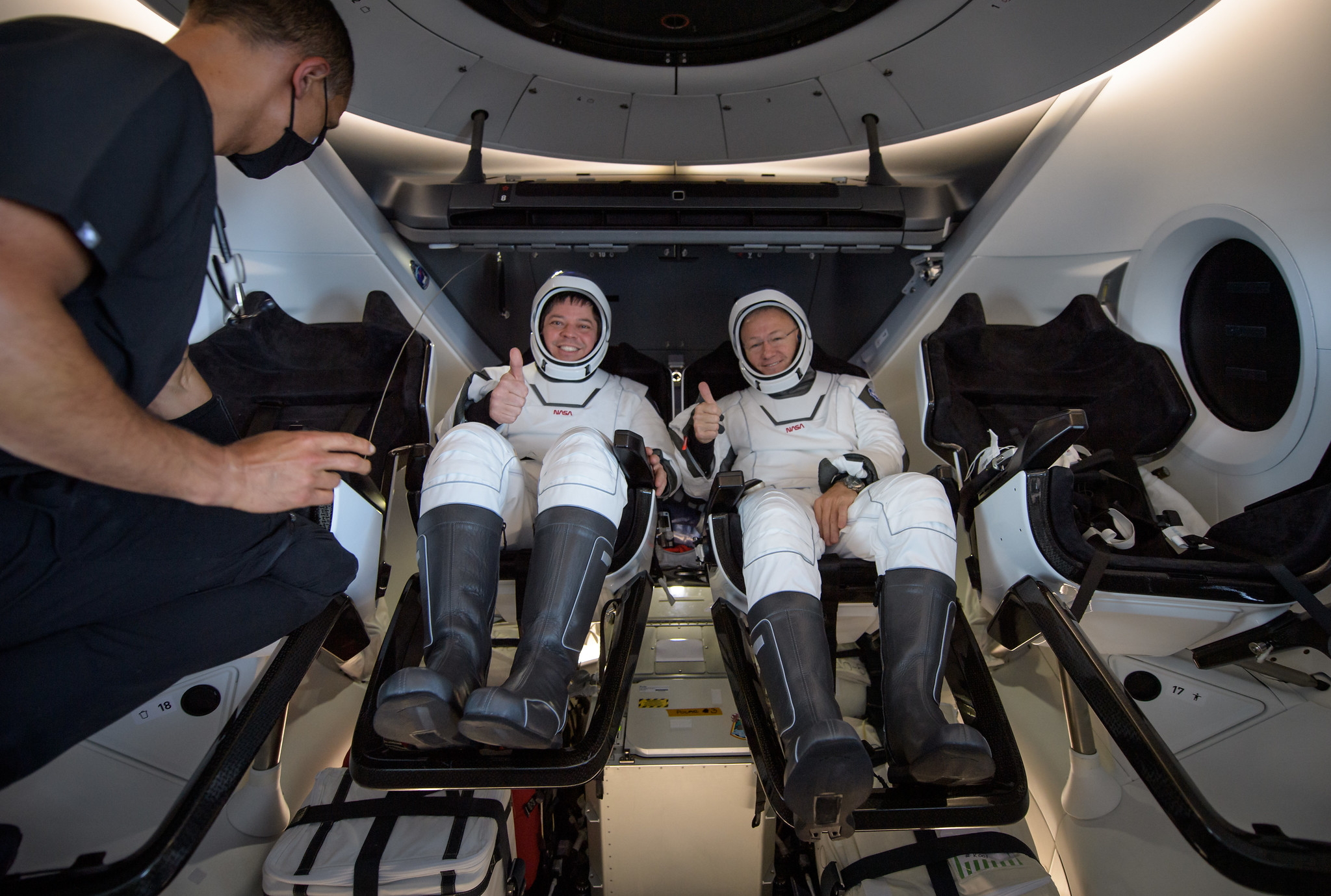 NASA astronauts Robert Behnken, left, and Douglas Hurley are seen inside the SpaceX Crew Dragon Endeavour spacecraft