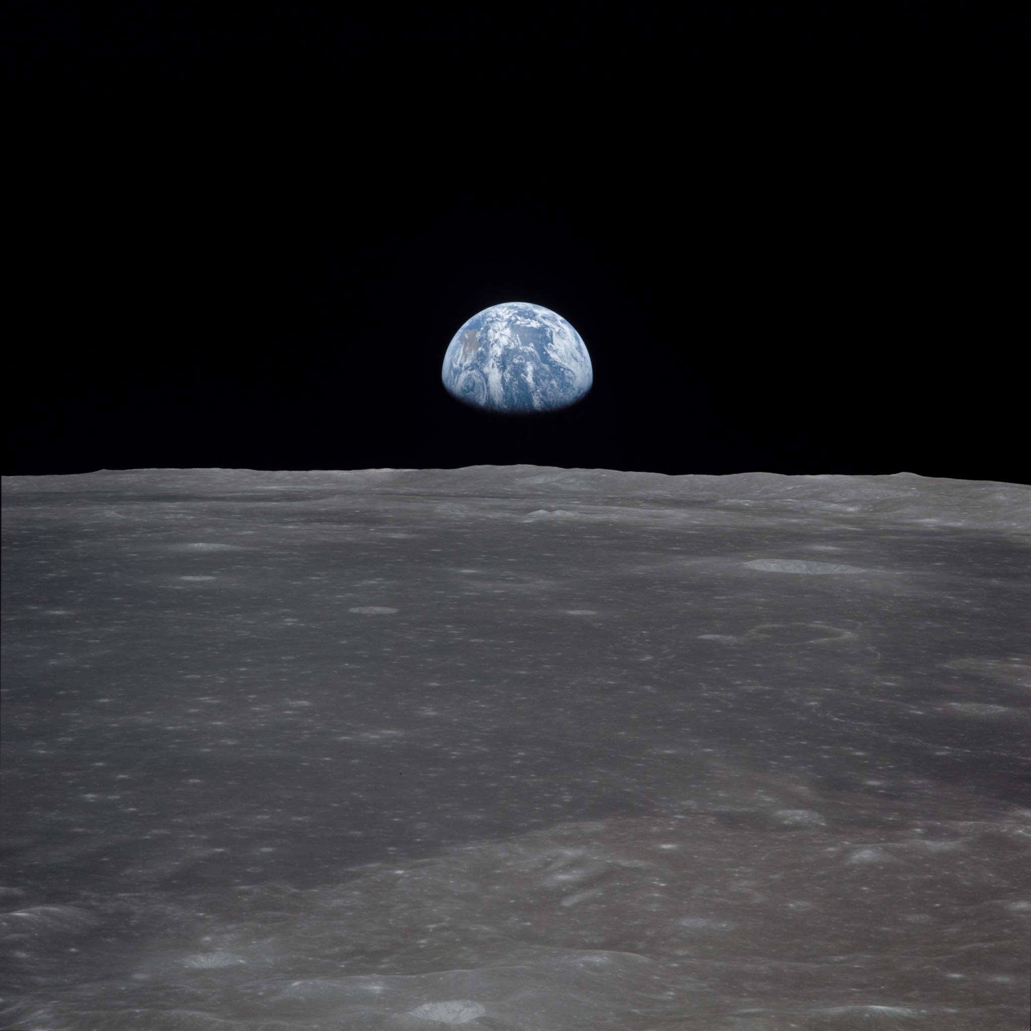 Apollo 11 Mission Image - View of Moon Limb, with Earth on the Horizon