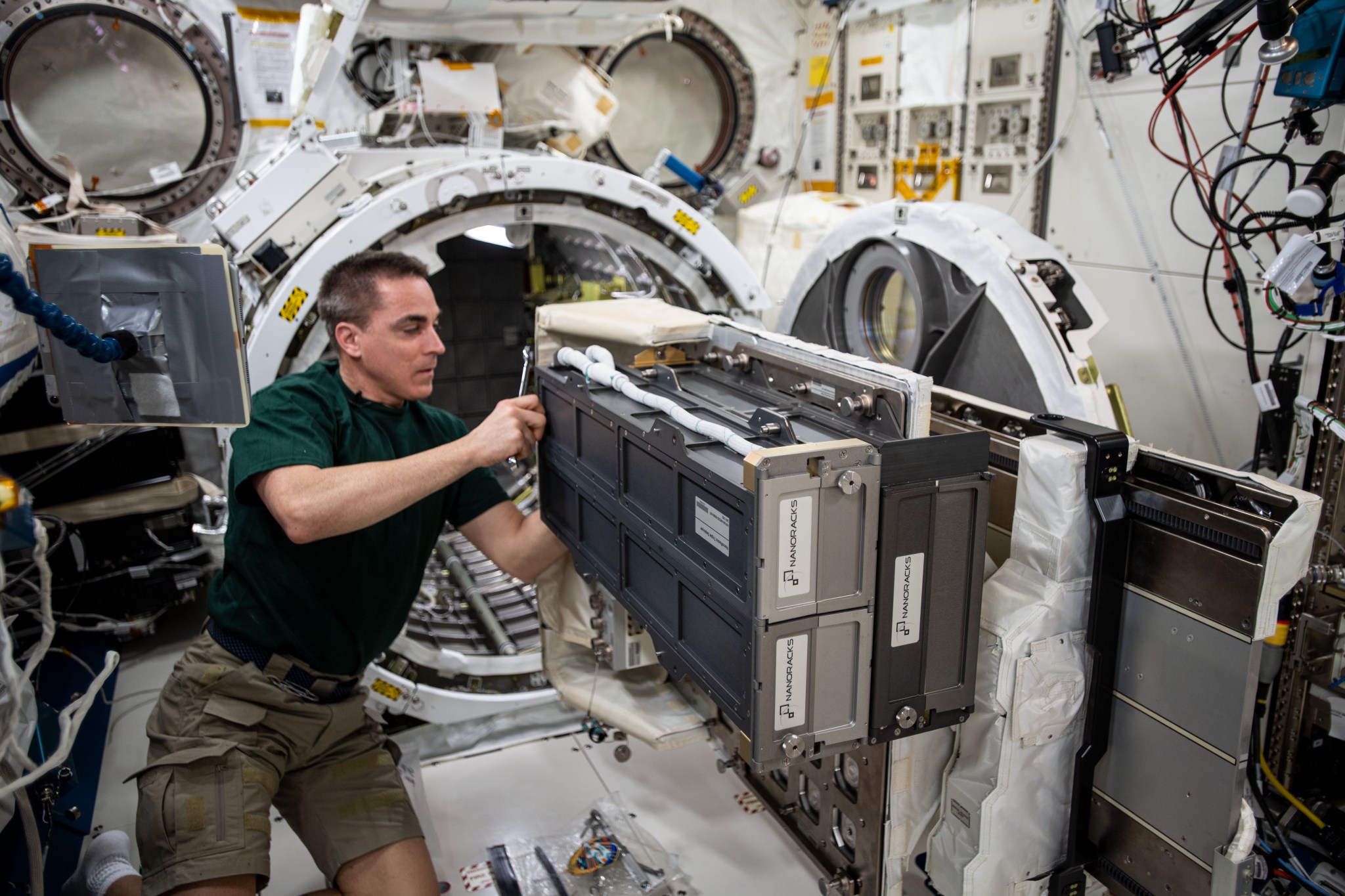 Expedition 63 Commander Chris Cassidy completing NanoRacks CubeSat Deployer Installation on the JEM Airlock