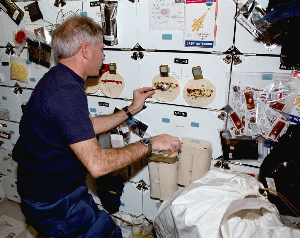 iss20_sts_98_cockrell_fixing_breakfast_burritos