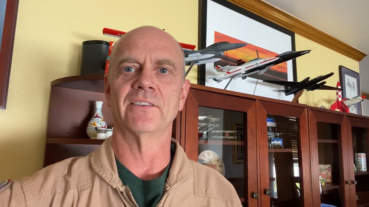 A close up picture of test pilot Nils Larson in his office.