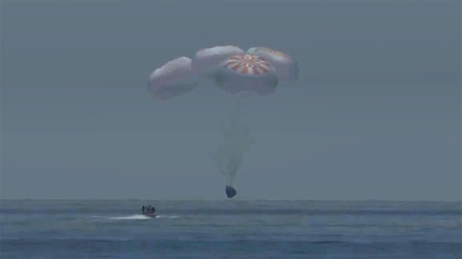 A SpaceX fast boat races toward the SpaceX Crew Dragon spacecraft moments before it splashed down in the Gulf of Mexico with NASA astronauts Bob Behnken and Doug Hurley aboard. Credit: NASA TV