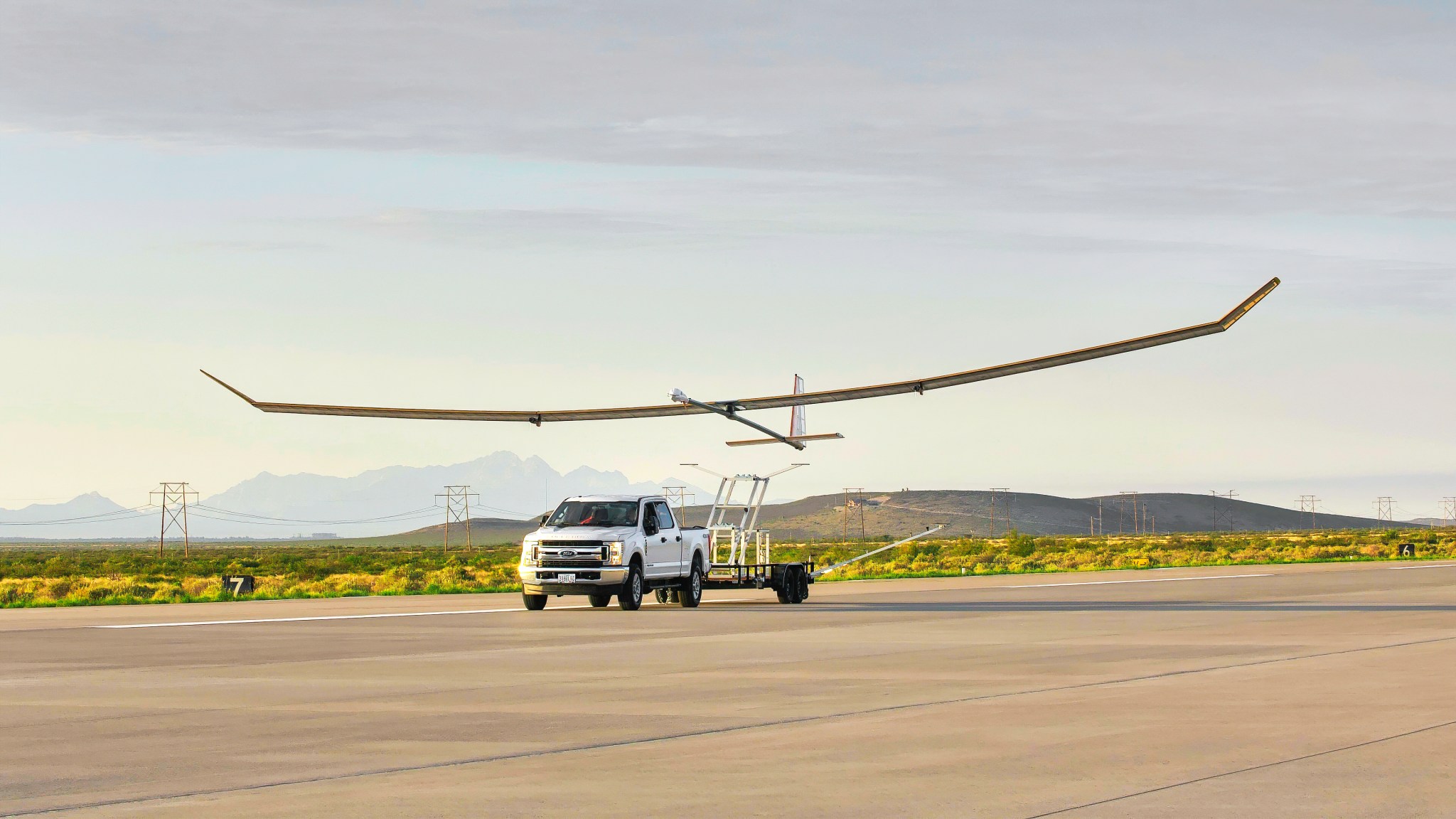 The Swift HALE high-altitude, long-endurance UAV taking off with a truck in the foreground