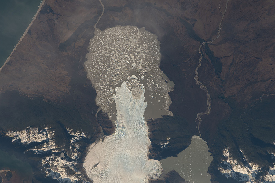 A glacier, pictured from the International Space Station, in the Laguna San Rafael National Park ends at the Rio Nevado in AysÃ©n, Chile.