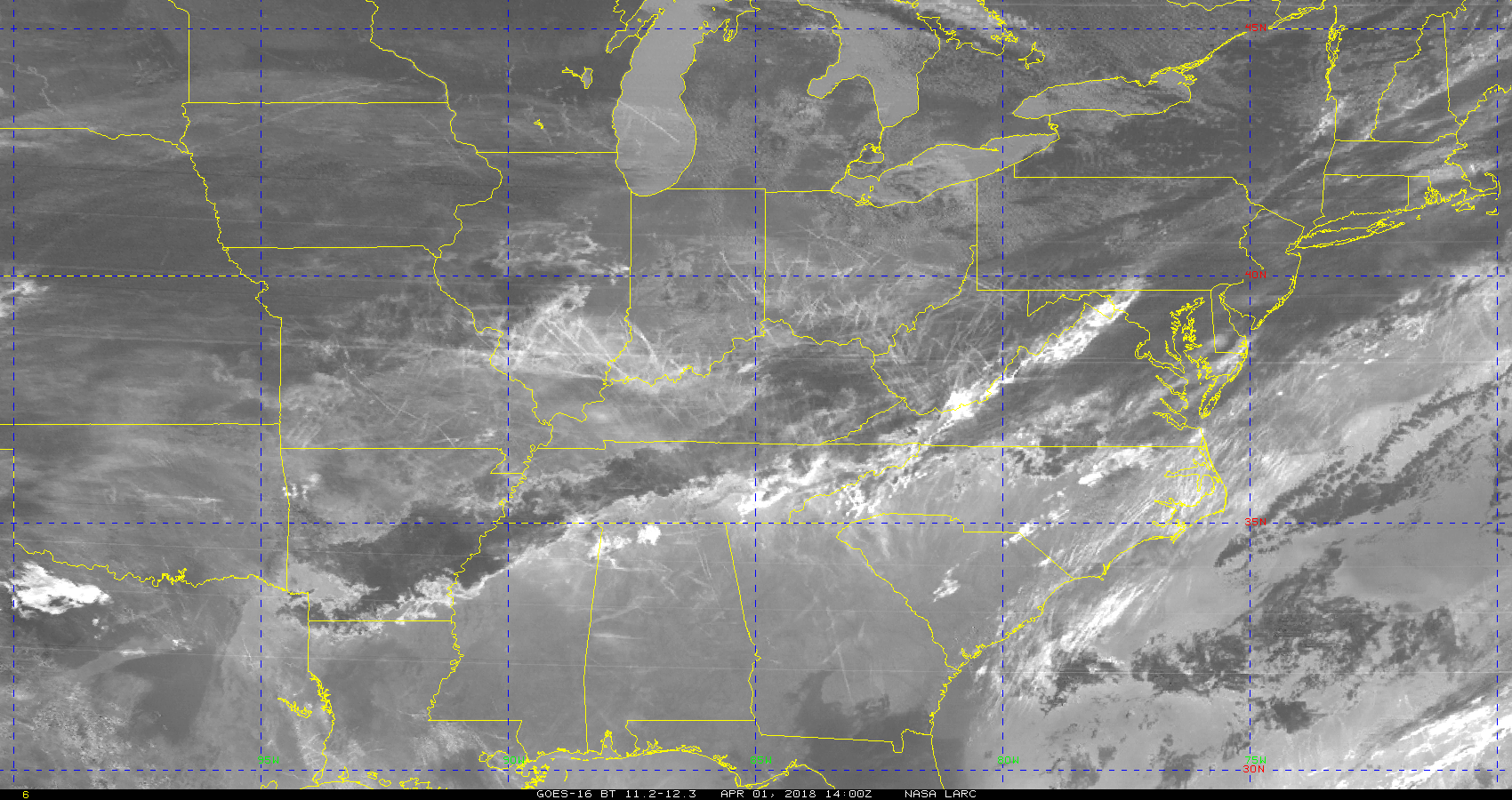 A satellite image in greys and whites showing cloud formations caused by aircraft 