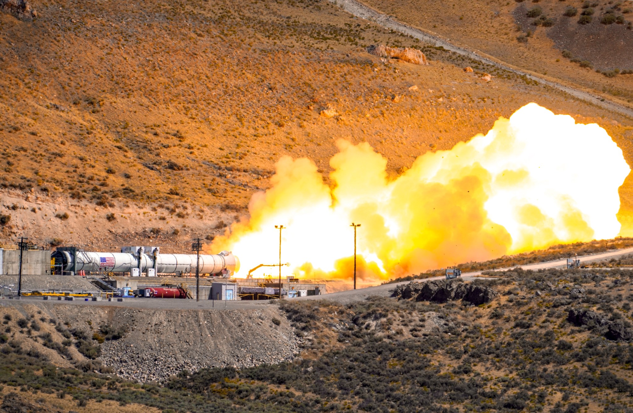 The flight support booster for future flights of NASA’s Space Launch System rocket undergoes a test Sept. 2.