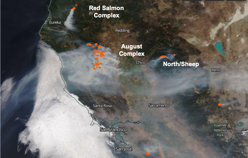 A satellite image of California and bordering states with a large smoke plume. Fires and hotspots are marked.