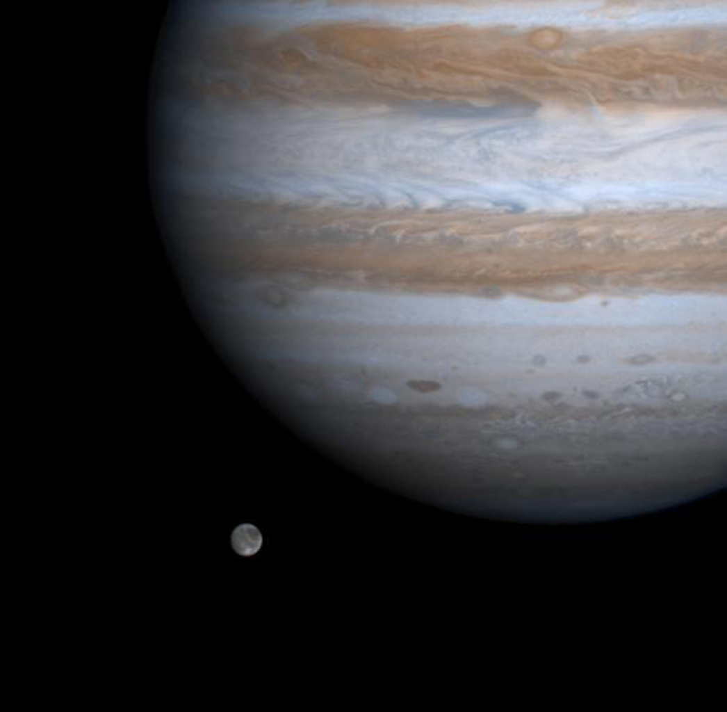 Jupiter in closeup and moon Ganymede