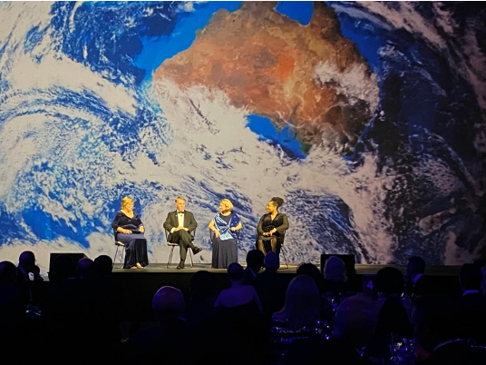 Christyl Johnson, Pamela Melroy, and Andy Thomas participate in a panel discussion at a State Dinner in Australia.
