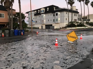 A flooded residential street in San Diego.
