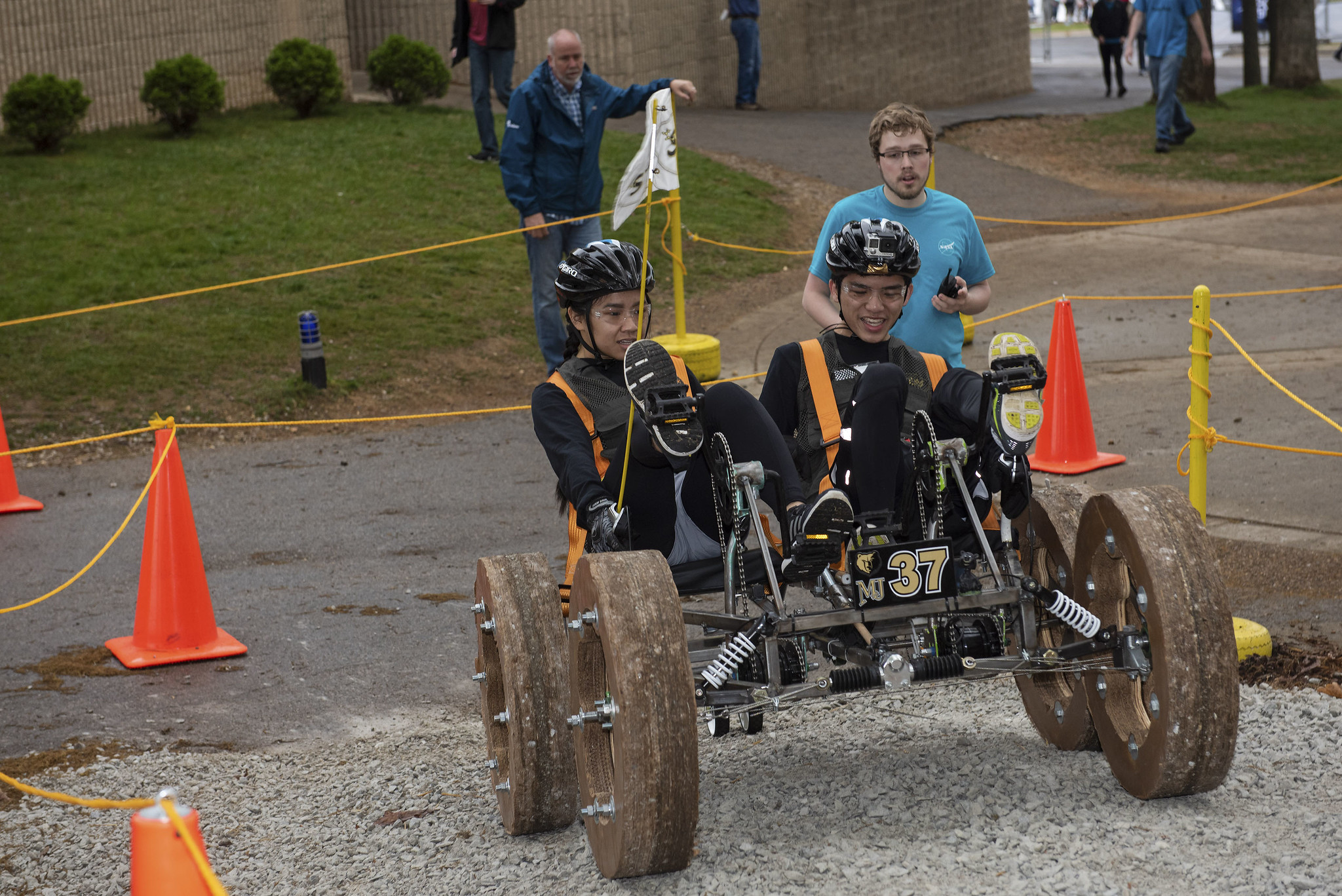 Two young people on a human powered rover