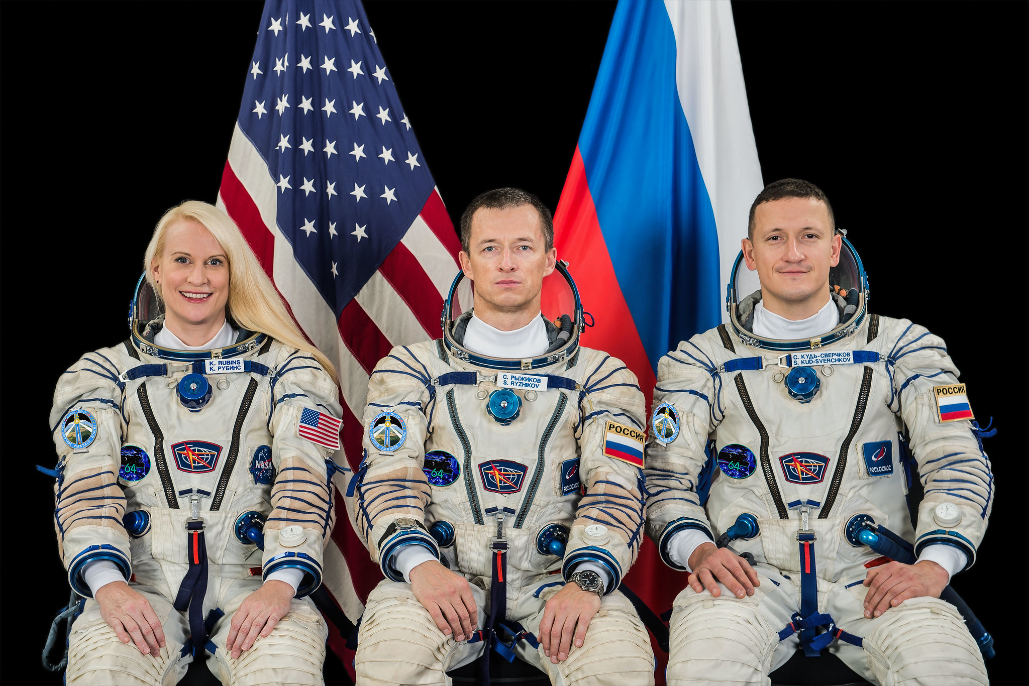 Expedition 64 crew members pose for portrait.